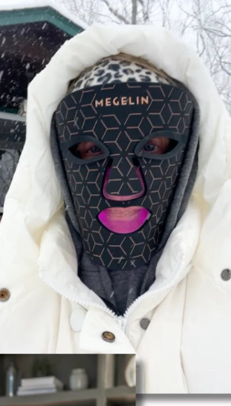 A member wearing an LED mask